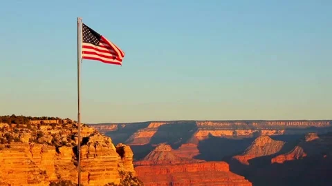 US flag Iconic classic shot of Grand Canyon at sunset with amazing lighting, Video stock 336577833