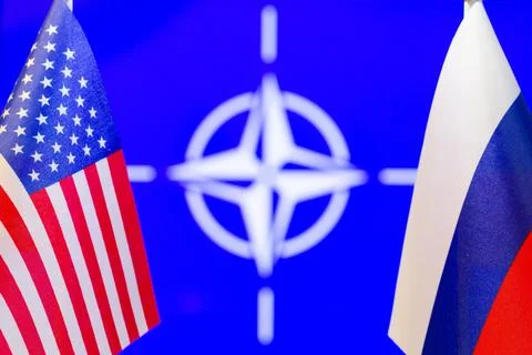The US flag, the Russian flag and NATO flag with copy space for text. Flag Stock Photos