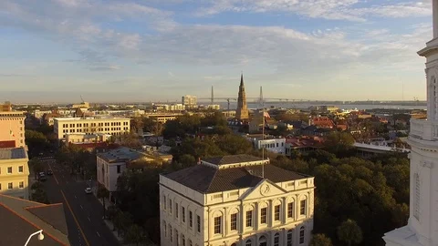 US Flag in the southern sky surrounded by historic architecture Stock Footage 125204066