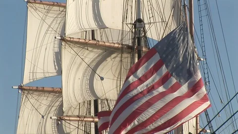 US flag with square rigged tall ship sails in San Diego, California US Stock Footage 105434734