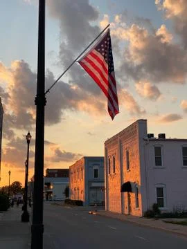 US Flag at sunset in small town Stock Photos