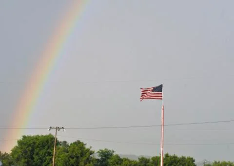 U.S. Flag under rainbow Stock Photos