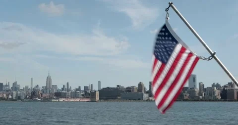 US Flag Waves From A Ferry With The New York City cityscape - 4K NYC Stock Footage 207602858
