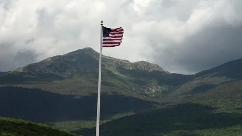 U.S. Flag Waving &amp; Mountains Stock Footage 107073570