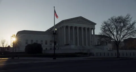 U.S. Flag Waving Over Supreme Court Building At Sunrise Video stock 237271259