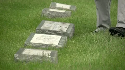 US flags being placed in front of graves Stock Footage 10972464