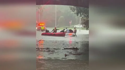 US: Flash Floods Swamp Rye Roads As Firefighters Rescue Stranded Drivers Stock Footage 345564899
