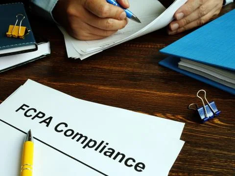 The US Foreign Corrupt Practices Act. FCPA Compliance Guide on the desk. Stock Photos