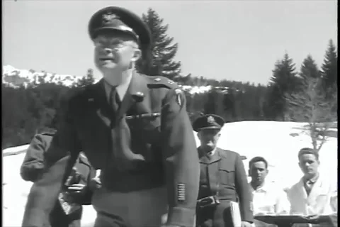 U.S. General Eisenhower observe, presented with an Alpine hat by soldier - 1951 Stock Footage 92483196