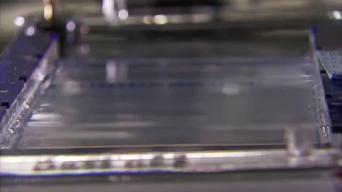 At the U.S. Government's Genome Sequencing Center, DNA is analyzed in the lab. Stock Footage