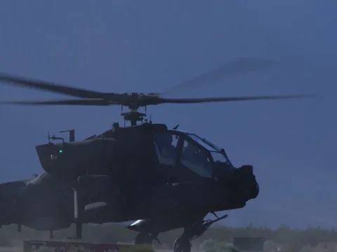 U.S. H-64 Apache helicopter landing at dusk 스톡 동영상 114489833