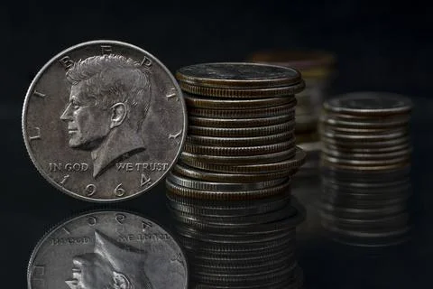 US Half Silver Dollar John Fitzgerald Kennedy 1964 Coin Stacks Blurred Backgr Stock Photos