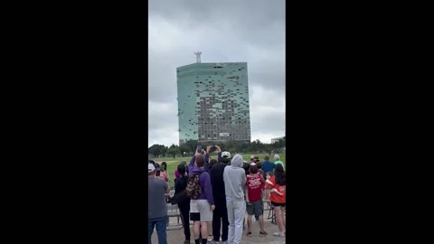 US: Hurricane-Damaged Capital One Tower In Lake Charles Imploded Video stock 283907965