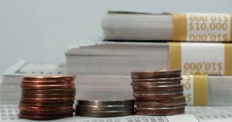 US Individual Tax Return Form 1040, coins and bundels of 100 dollar bills. Stock Footage 267291142