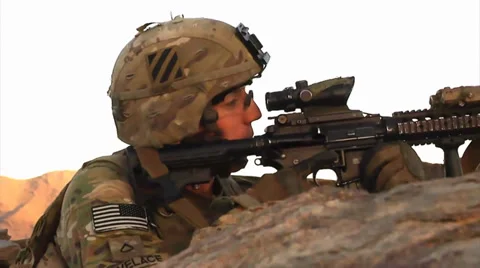 U.S. infantry soldier looking through sights of his rifle Stock Footage 32631331