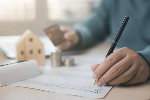 US IRS 1040 form or  US Individual income tax Concept,accountant holding pen  Stock Photos