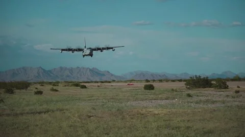 U.S. KC-130 Hercules approaching dirt runway for touch and go landing Stock Footage 270530864