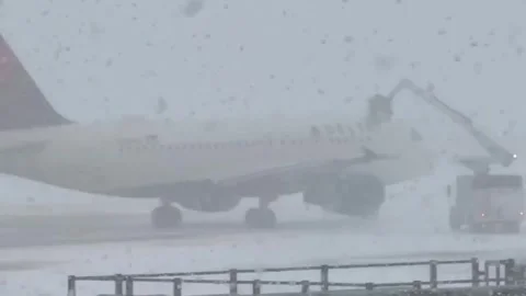 US: Lake-Effect Snow Turns Airport Tarmac Into Whiteout Chaos In Rocheste... Stock Footage 325347129