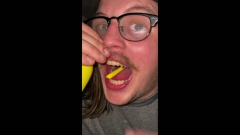 US: Magician performs balloon string nose-to-mouth trick in Cleveland, USA Stock Footage 288852116