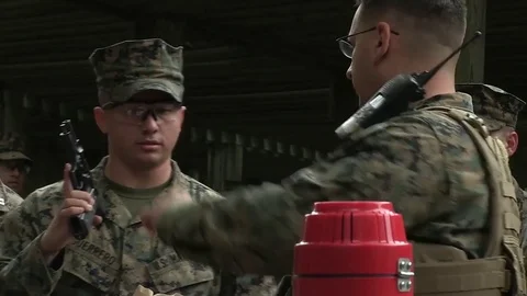 U.S. Marine checking pistol for combat pistol training program at Camp Lejeune Stock Footage 82300143
