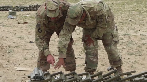 A US Marine explains the set up a Code H demolition out in the desert, 2010s Stock Footage 112533743