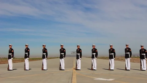 U.S. Marine honor guard performs as plane does a flyover. Stock Footage 123369754