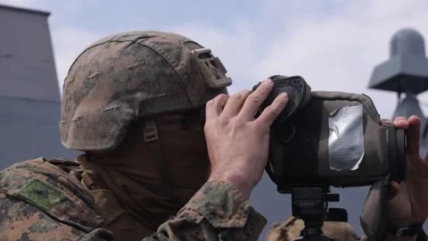 U.S. Marine looking through binoculars during a Visit, Board, Search and Seizure Video stock 301195350