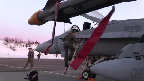 U.S. Marine pilot climbing down from F/A-18 Hornet cockpit  Stock Footage 268206713