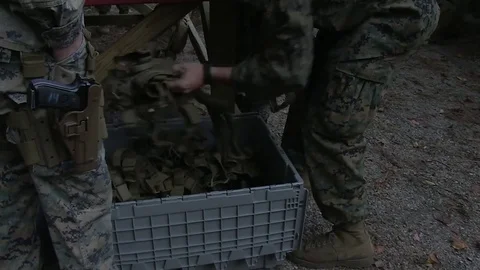 U.S. Marine storing equipment for combat pistol training program at Camp Lejeune Stock Footage 82298997