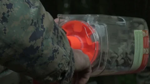 U.S. Marine using ear plugs for combat pistol training program at Camp Lejeune Video stock 82298678