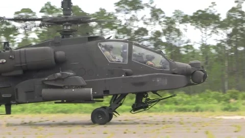 U.S. Marines AH-64 Apache taxiing on outlying landing field Stock Footage 279728486