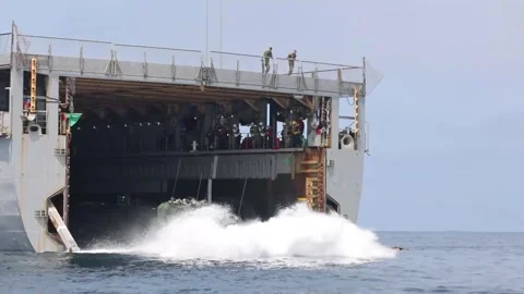 U.S. Marines Amphibious Combat Vehicles exiting well deck of USS Germantown Stock Footage 282170610