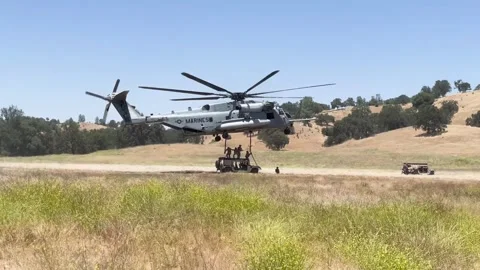 U.S. Marines attaching sling load to CH-53 Super Stallion Stock Footage 278581340