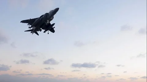 U.S. Marines AV-8B Harrier conducting vertical landing aboard USS Wasp (LHD 1) Stock Footage 291637051