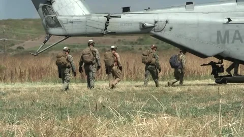 U.S. Marines boarding CH-53 Super Stallion for rapid insertion training Stock Footage 280034175