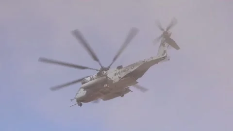 U.S. Marines CH-53 Super Stallion helicopter flying through dust cloud Stock Footage 254065702