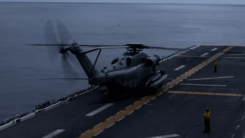 U.S. Marines CH-53 Super Stallion ground running aboard U.S. Navy USS America Stock Footage 265231325