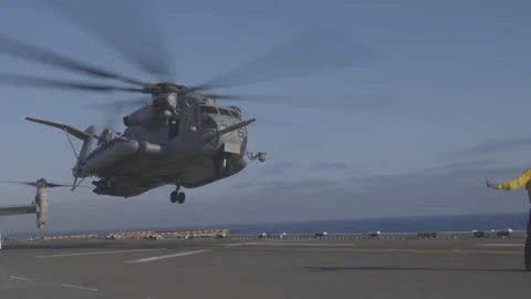 U.S. Marines CH-53 Super Stallion helicopter landing aboard USS Tripoli Stock Footage 280385622