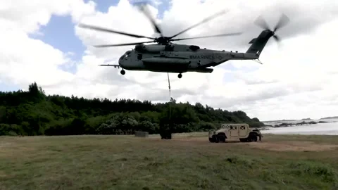 U.S. Marines CH-53 Super Stallion lowering sling load  Video stock 300344762