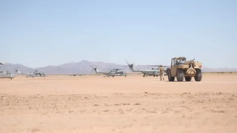 U.S. Marines CH-53 Super Stallions and MV-22 Osprey Conduct Ground Operations Stock Footage 334835306