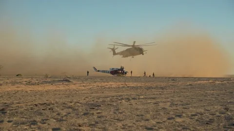 U.S. Marines CH-53E Super Stallion creates sand storm during external lift Stock Footage 254402744