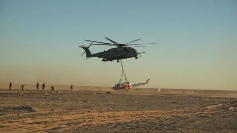 U.S. Marines CH-53E Super Stallion lowering helicopter during exeternal lift Stock Footage 254402749
