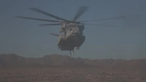 U.S. Marines CH-53K King Stallion hovering with chains to perform heavy lift Stock Footage 253998020