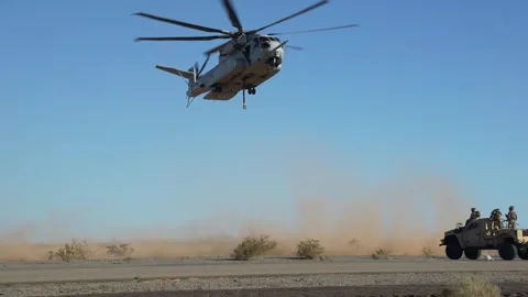 U.S. Marines CH-53K King Stallion arrives in desert to perform an external lift Stock Footage 254402787
