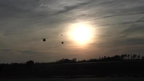U.S. Marines CH-53K King Stallion helicopter flying at dawn Stock Footage 258336167