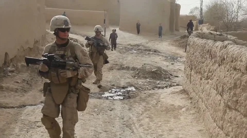 U.S. Marines conduct a security patrol in Sangin, Afghanistan - 2012 Stock Footage 104315297