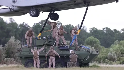 U.S. Marines conducting sling load operations with Light Armored Vehicle Video stock 285396776