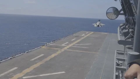 U.S. Marines F-35B Lightning II taking off from flight deck of USS Tripoli Stock Footage 280385586
