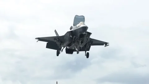 U.S. Marines F-35B Lightning II hovering prior to vertical landing Stock Footage 282170737