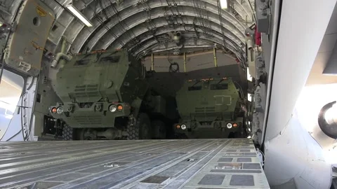 U.S. Marines HIMARS reversing onto Royal Canadian Air Force C-17 Globemaster III Stock-Footage 294751697